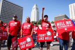Los Angeles, CA - March 23: Postal workers Darrell Jefferies, Molly Berge, Shannon Canzoneri, and Maria Guerra rally at the Federal Building to protest the possible privatization of the USPS under the Trump administration on Sunday, March 23, 2025 in Los Angeles, CA. Juliana Yamada / Los Angeles Times via Getty Images