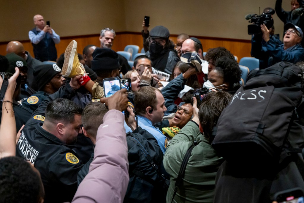 Scuffles erupt at a New Orleans City Council delaying the meeting as demonstrators demand action to prevent Immigration and Customs Enforcement (ICE) to detail and disappears thousands of migrants on December 4, 2025, in New Orleans, Louisiana. Border Patrol Commander Greg Bovino has moved hundreds of agents to Louisiana in the “Catahoula Crunch” sweep to detain and deport thousands of persons, following Donald Trump's orders to deport a million undocumented immigrants by the end of the year. Photo by Michael Nigro.
