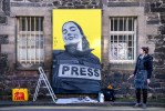 Artist and illustrator Anna Dittmann, from Abbeyhill, Edinburgh, works on a mural at Quality Yard in Leith, that features Bisan Owda, a 25-year-old journalist in Palestine. Picture date: Sunday January 28, 2024. Photo by Jane Barlow/PA Images via Getty Images