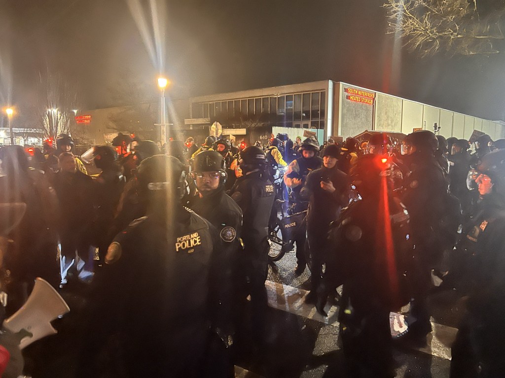 Local Portland police cleared protesters from the road in front of the south Waterfront ICE facility in Portland, Oregon. Photo by Shane Burley.