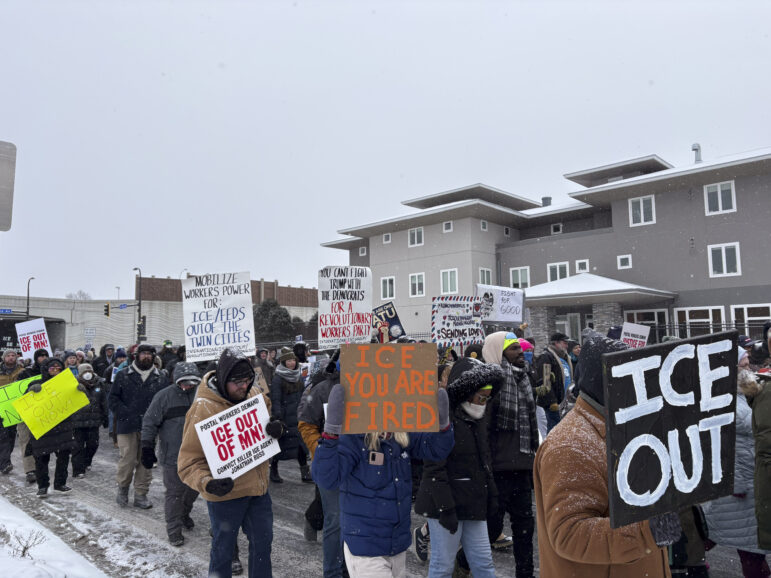 ‘Protect our routes, get ICE out’: postal workers rally in Minneapolis