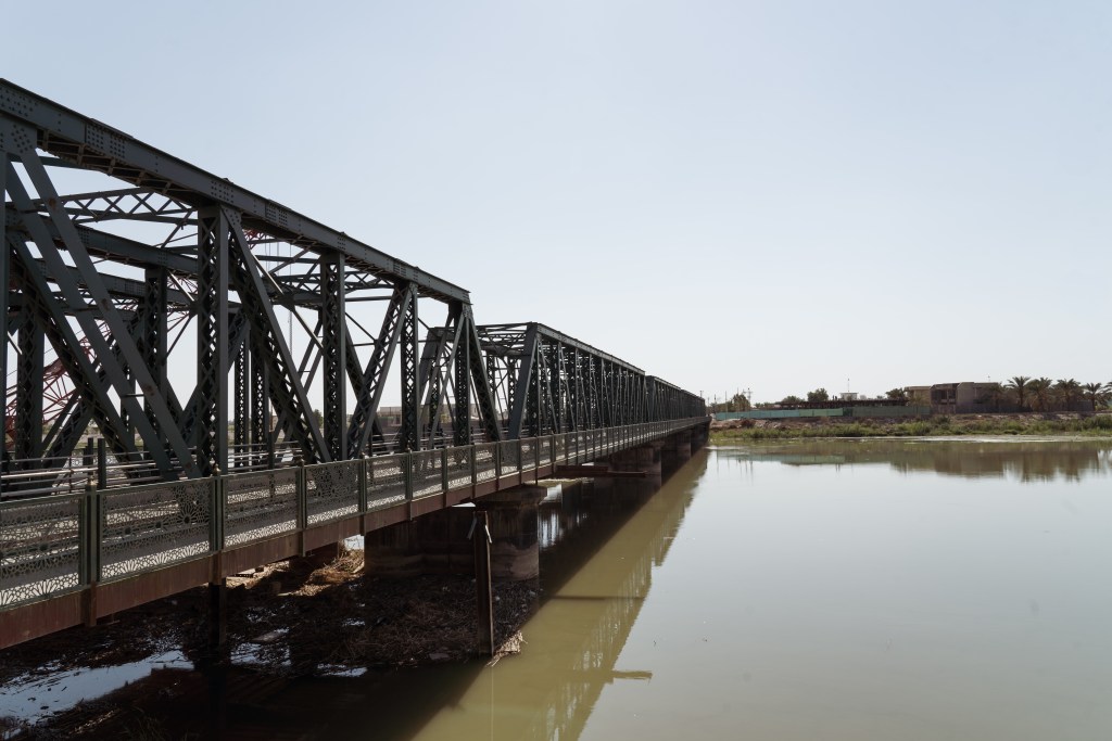 The main bridge over the Euphrates River in Fallujah, where two of four American contractors ambushed in March 2004 were hung. The incident triggered massive US assaults later that year, when weapons tied to today’s health crisis were used. Photo by Jaclynn Ashly.