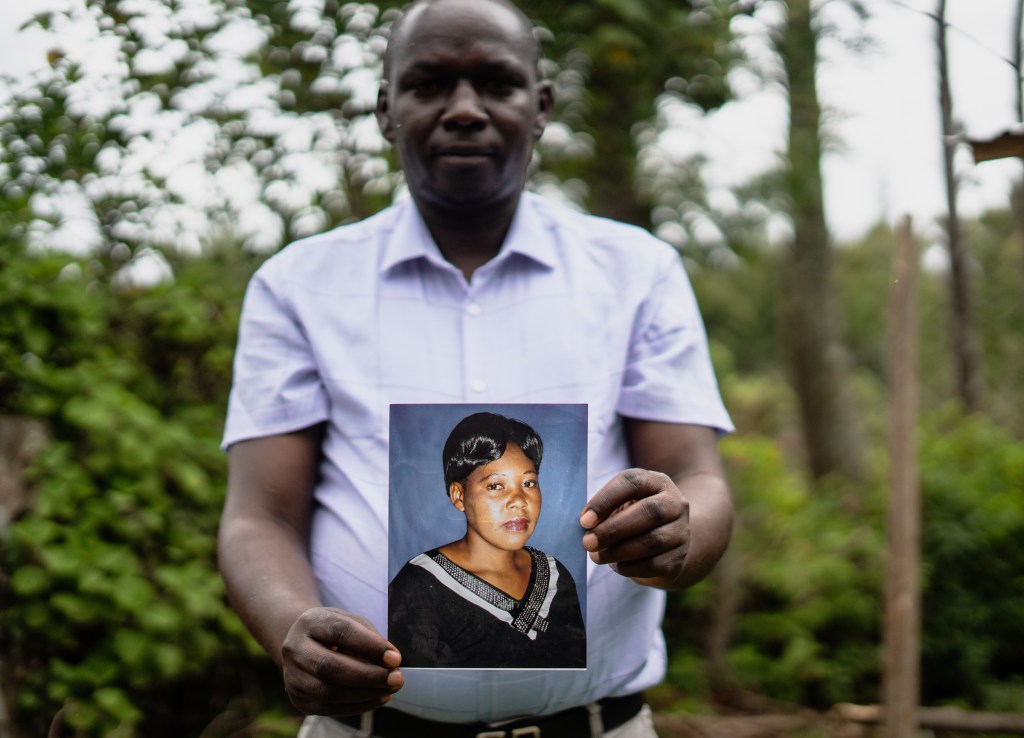 Harun Muigai Nganga holds a photo of his sister, Lucy Wambui Nganga, a mother of four who died in Iraq in 2020 after being trafficked from Saudi Arabia. Harun has been central to the family’s years-long struggle to repatriate her body. Photo by Jaclynn Ashly.